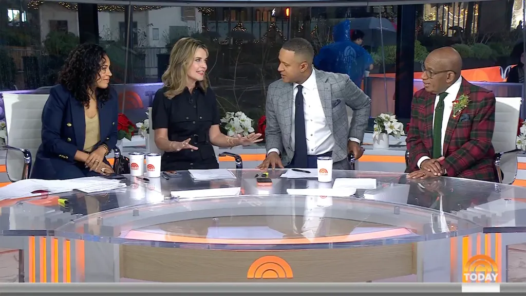 Savannah Guthrie and her co-hosts sitting at the Today Show desk.